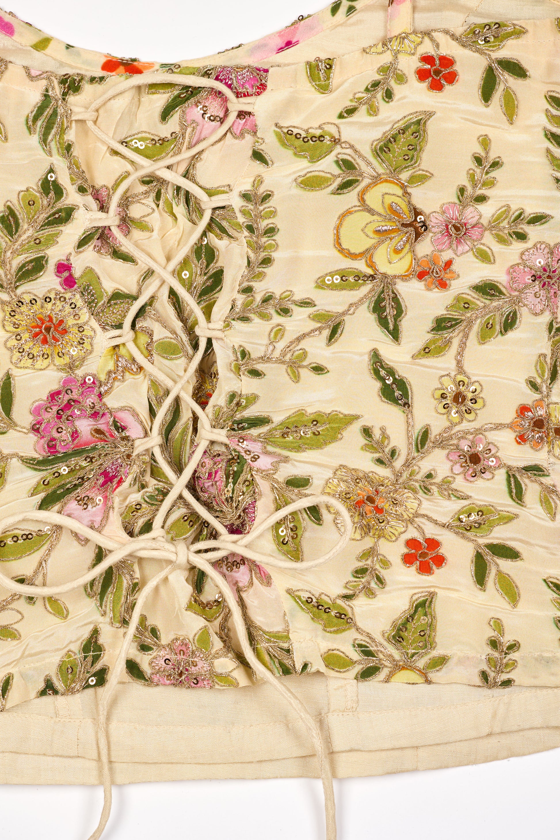 Embroidered fabric with floral and butterfly patterns on a white background