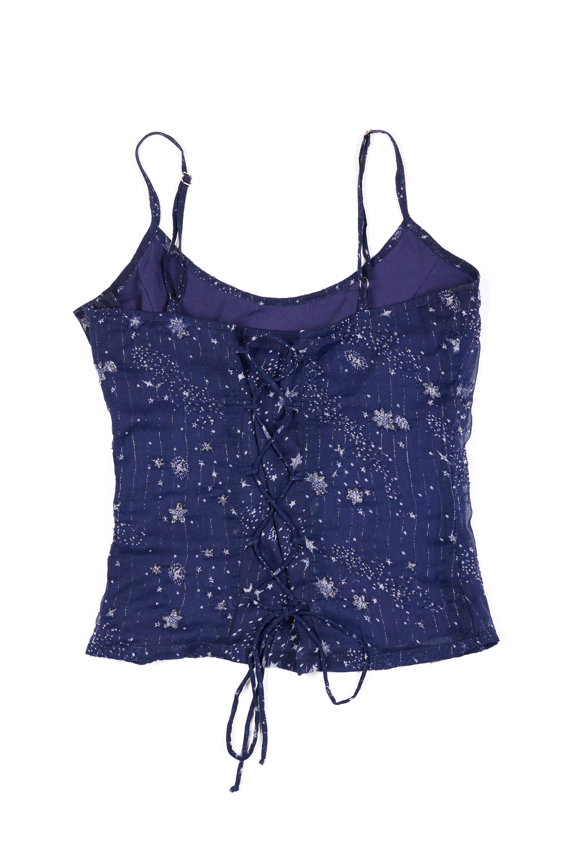 Purple star-patterned top on a white background
