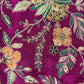 Close-up of floral embroidery on a purple fabric