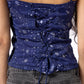 Blue star-patterned top worn by a person with a blurred background